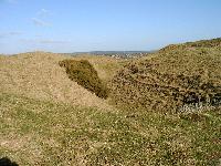 Maiden Castle earthen walls and dry moats - looking north