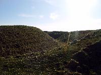Maiden Castle earthen walls and dry moats - looking south