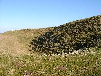 Maiden Castle second line of earthen walls and dry moats - looking north